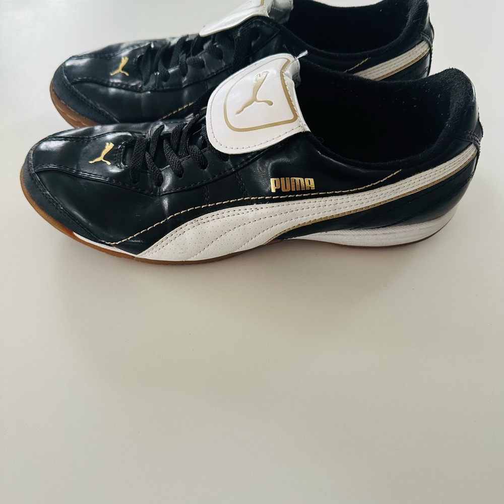 Puma Black and White Indoor Soccer Shoes with Gold Details